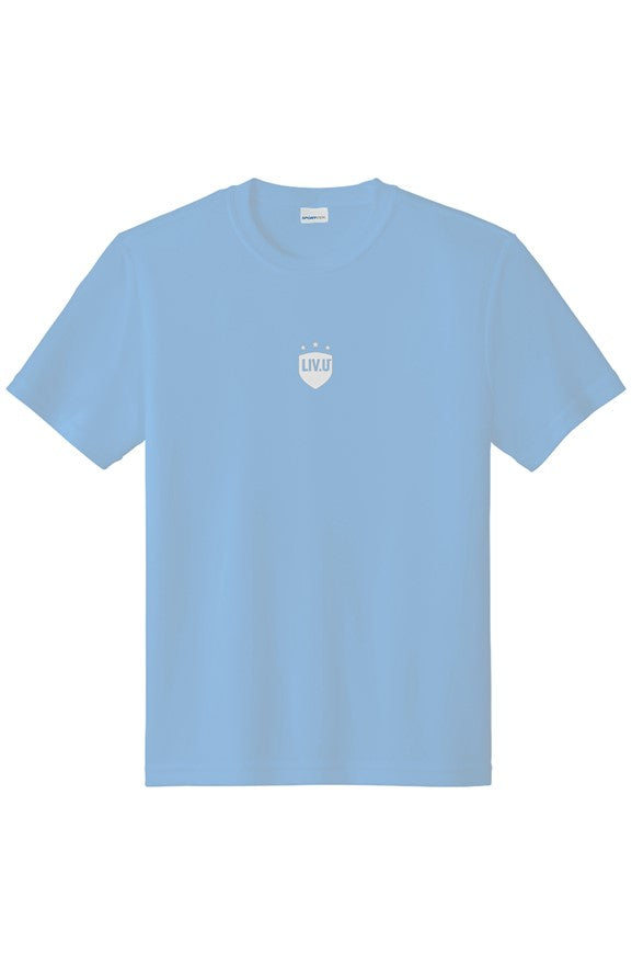 LIV.U® Children’s tee in light blue with shield logo, promoting fútbol, family, and community for kids.